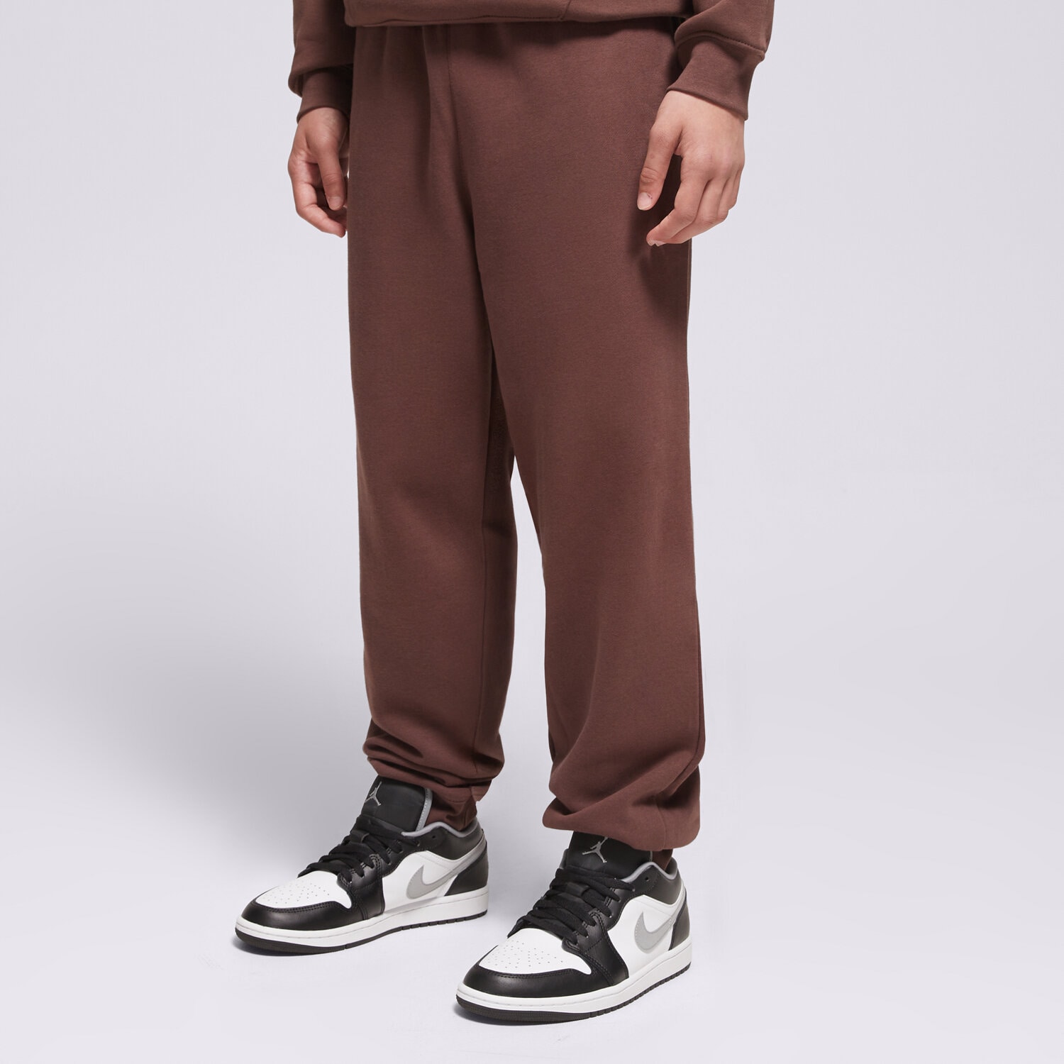 Sportowe spodnie dziecięce JORDAN SPODNIE MJ BRKLN FLC PANT BOY 95F113-X25 BRĄZOWY