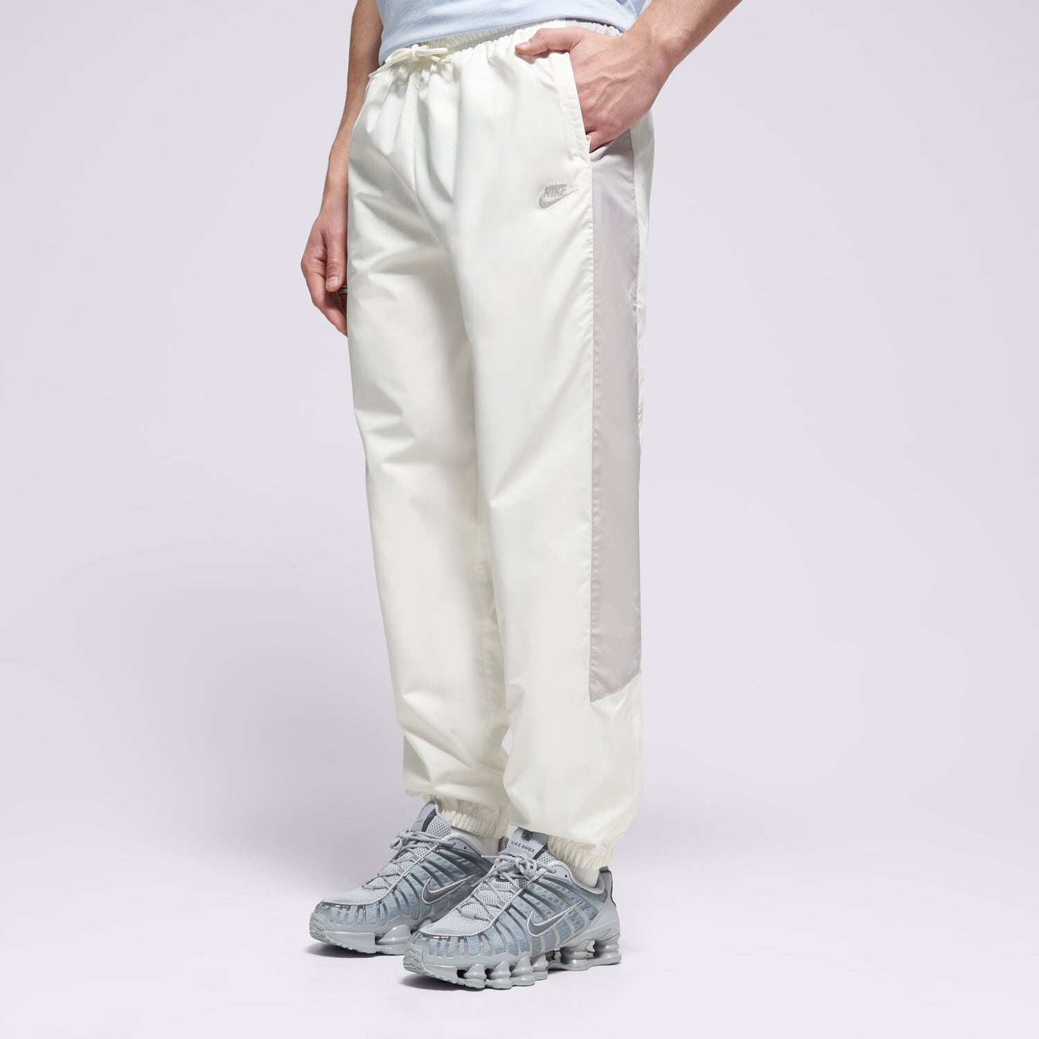 Spodnie sportowe męskie NIKE SPODNIE M NK WR LND PANT 26 HV8371-134 BIAŁY