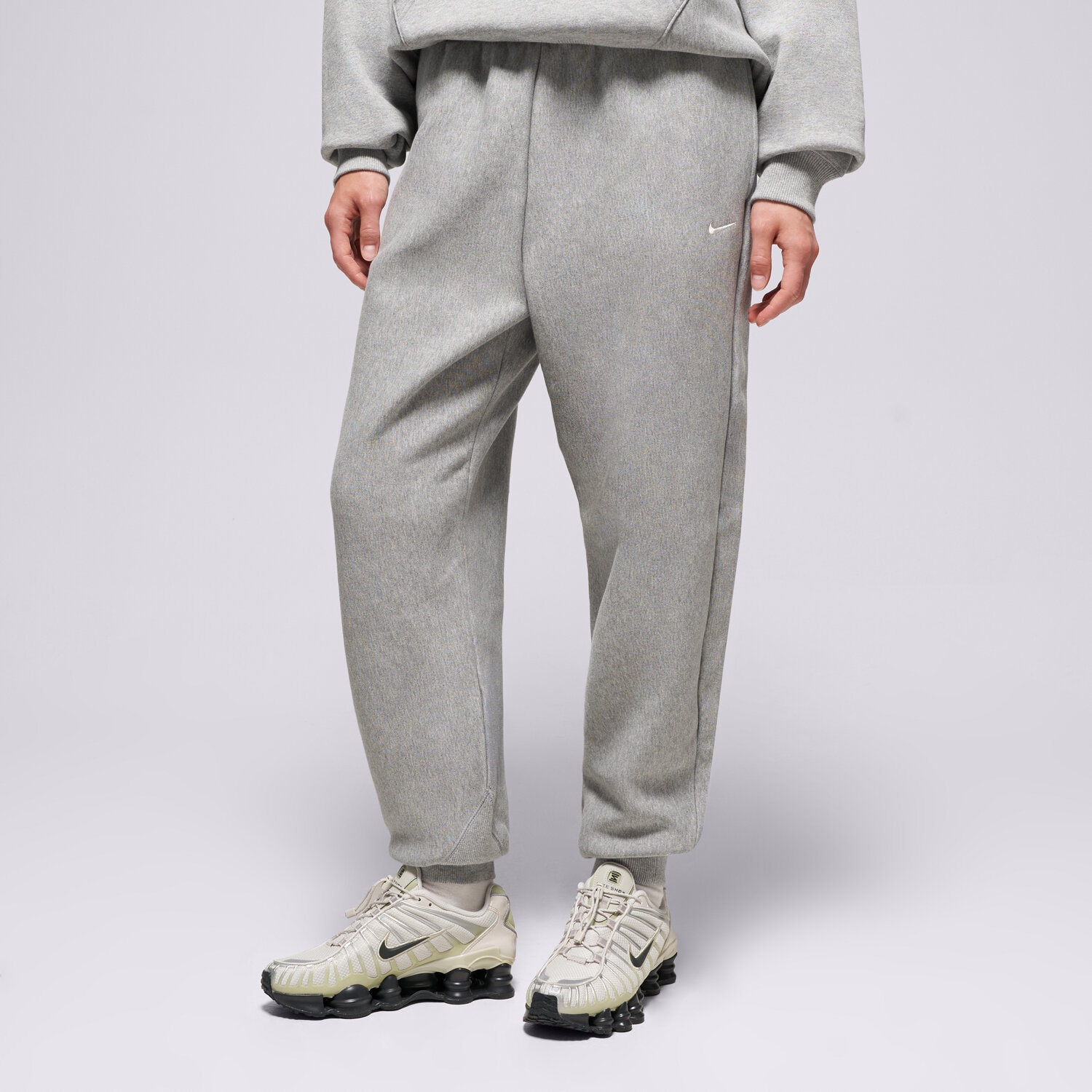 Spodnie sportowe damskie NIKE SPODNIE W NK STDO OS JOGGER FLC HVY IO2109-063 SZARY
