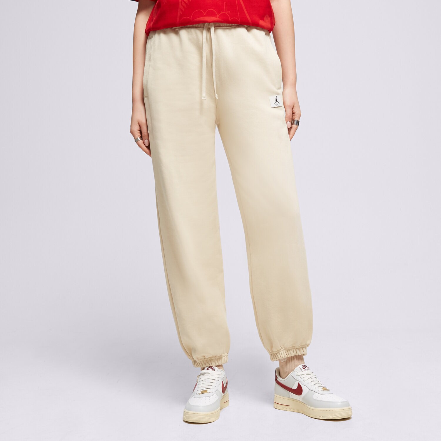 Spodnie sportowe damskie SPODNIE W JORDAN FLT FLC PANT  DQ4607-234 BEŻOWY