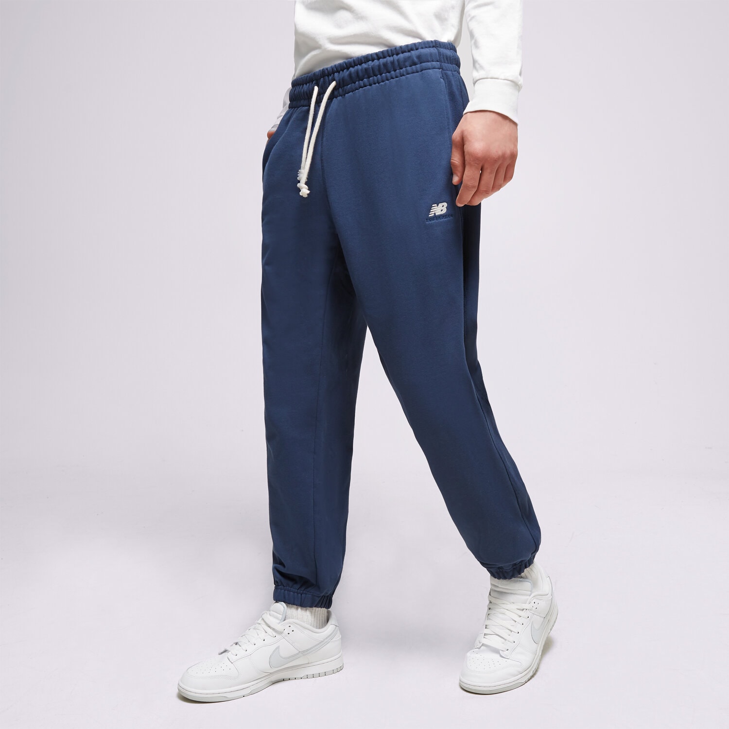 Spodnie sportowe męskie NEW BALANCE SPODNIE ATHLETICS REMASTERED FRENCH MP31503NNY GRANATOWY