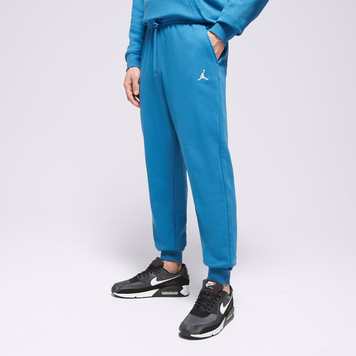 Spodnie sportowe męskie SPODNIE M JORDAN ESS FLC PANT LB FQ7761-457 NIEBIESKI