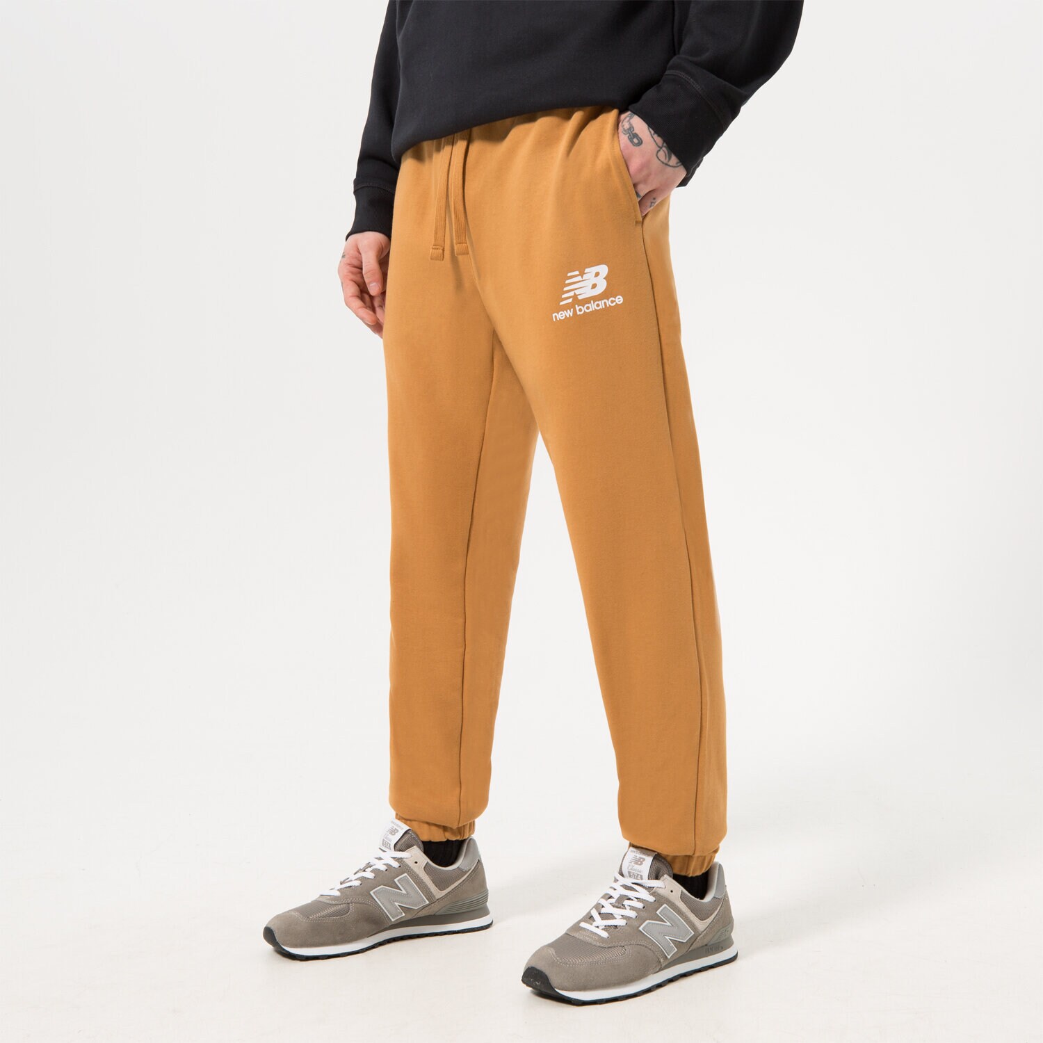 Spodnie sportowe męskie NEW BALANCE SPODNIE NB ESSENTIAL STACKED MP31539TOB BRĄZOWY