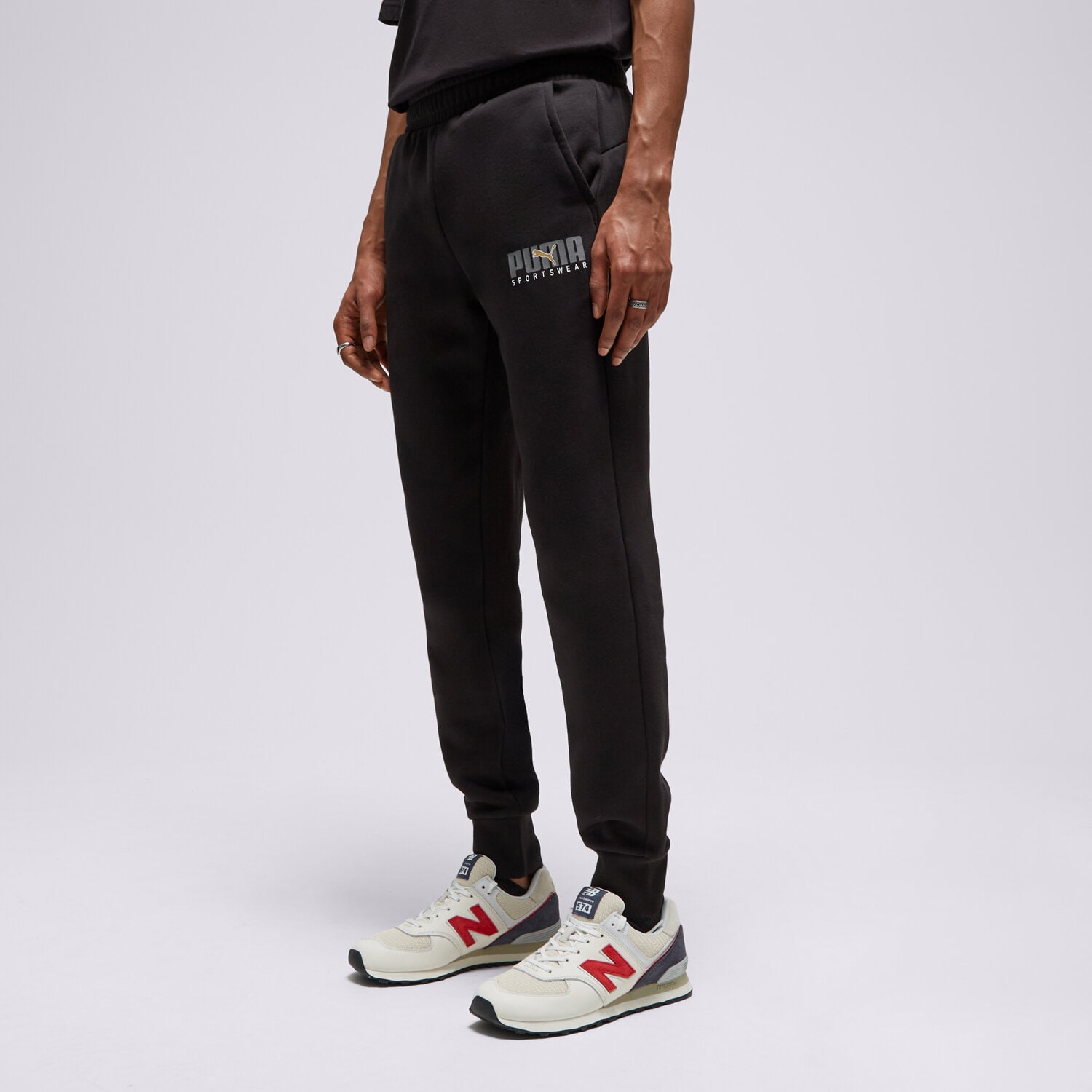 Spodnie sportowe męskie PUMA SPODNIE CORE SPTSW PANTS BLK/GLD 67488601 CZARNY