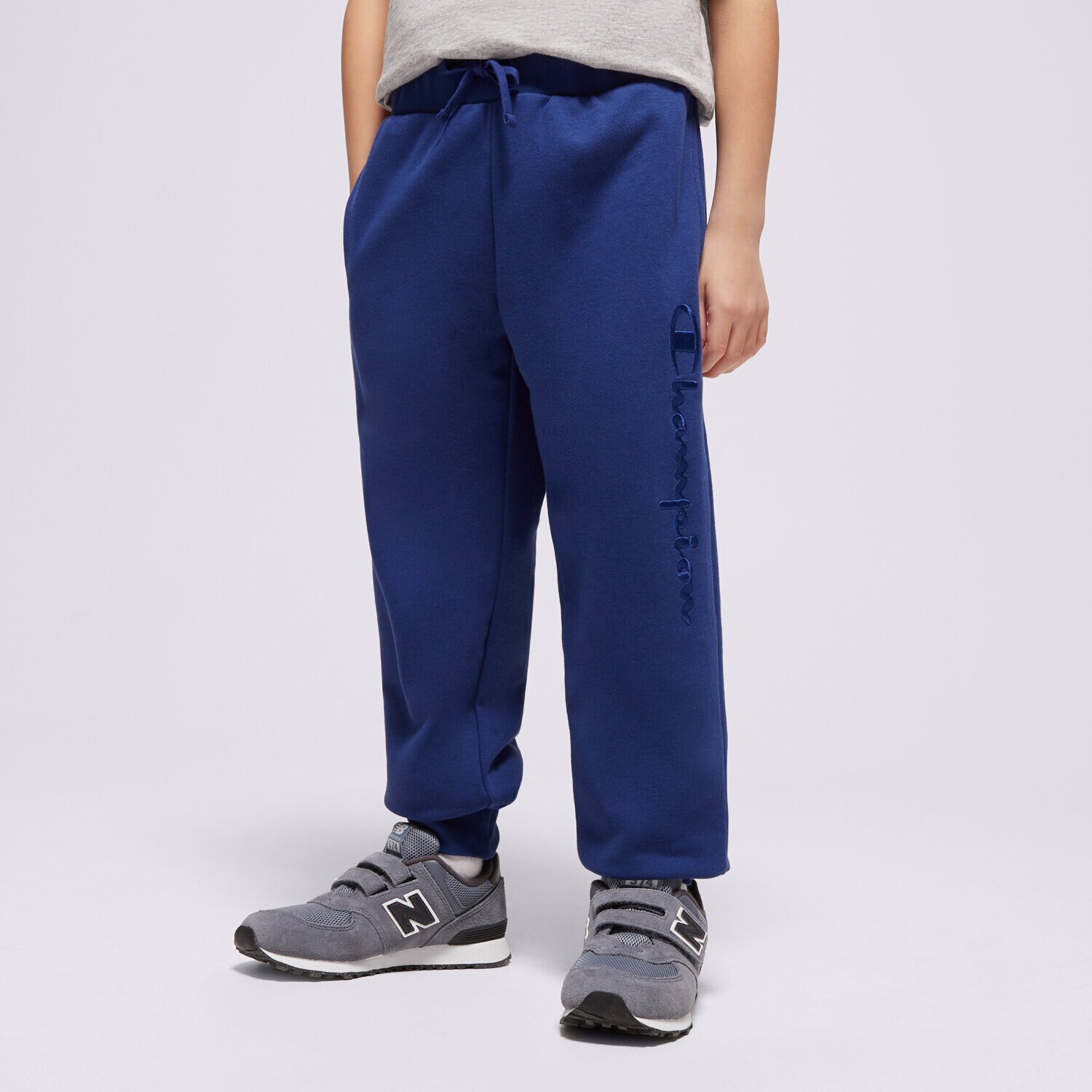 Sportowe spodnie dziecięce CHAMPION SPODNIE RIB CUFF PANTS B 306765BS559 GRANATOWY