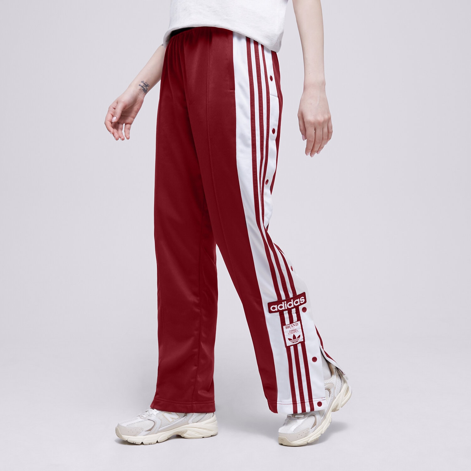 Spodnie sportowe damskie ADIDAS SPODNIE ADIBREAK TP IB7297 CZERWONY