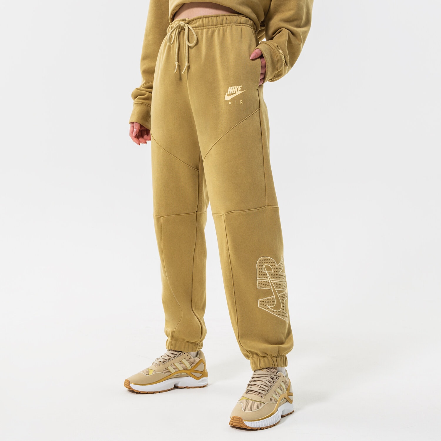 Spodnie sportowe damskie NIKE SPODNIE W NSW AIR FLC PANT DM6061-769 Neon różowy