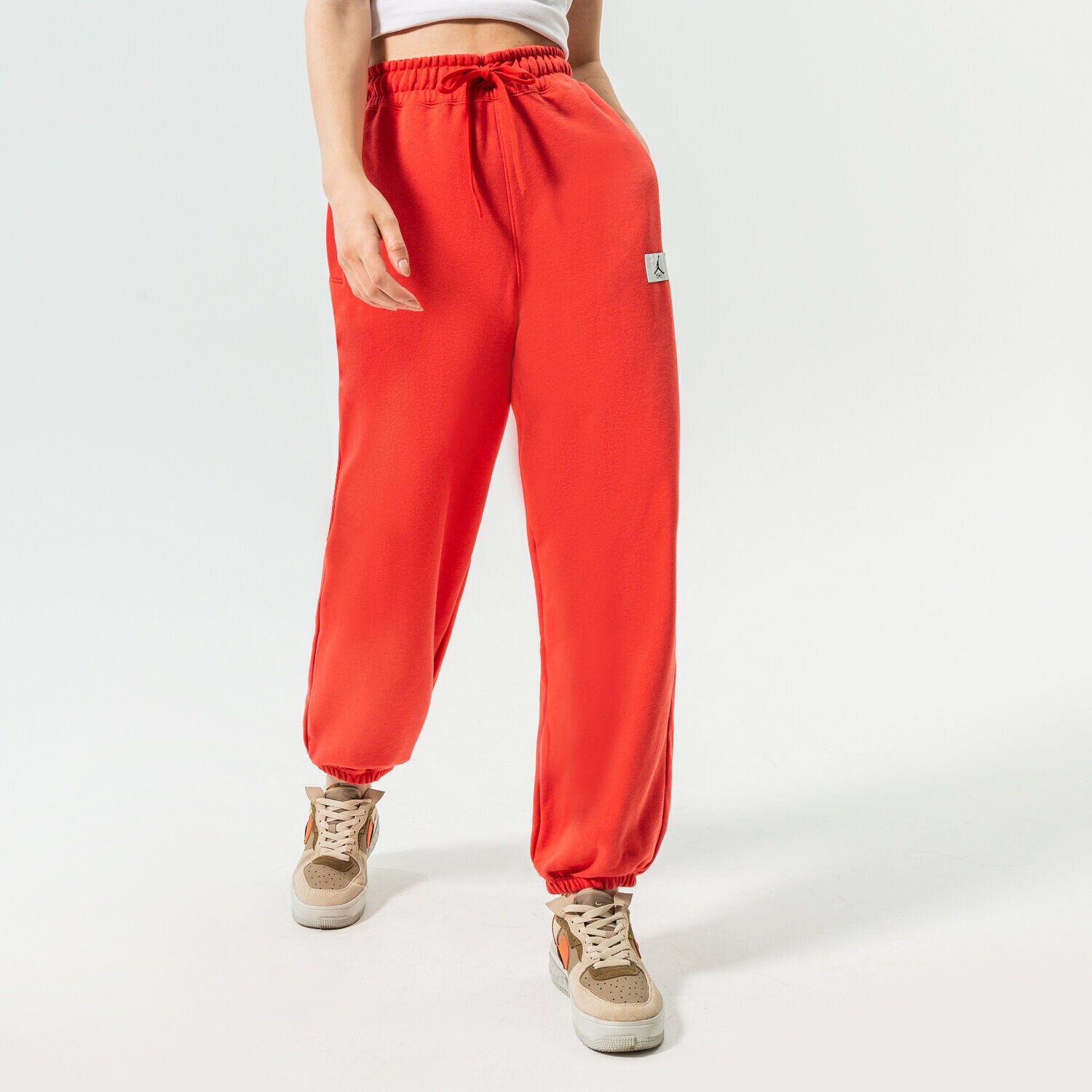 Spodnie sportowe damskie JORDAN SPODNIE W J FLT FLC PANT DQ4607-605 CZERWONY