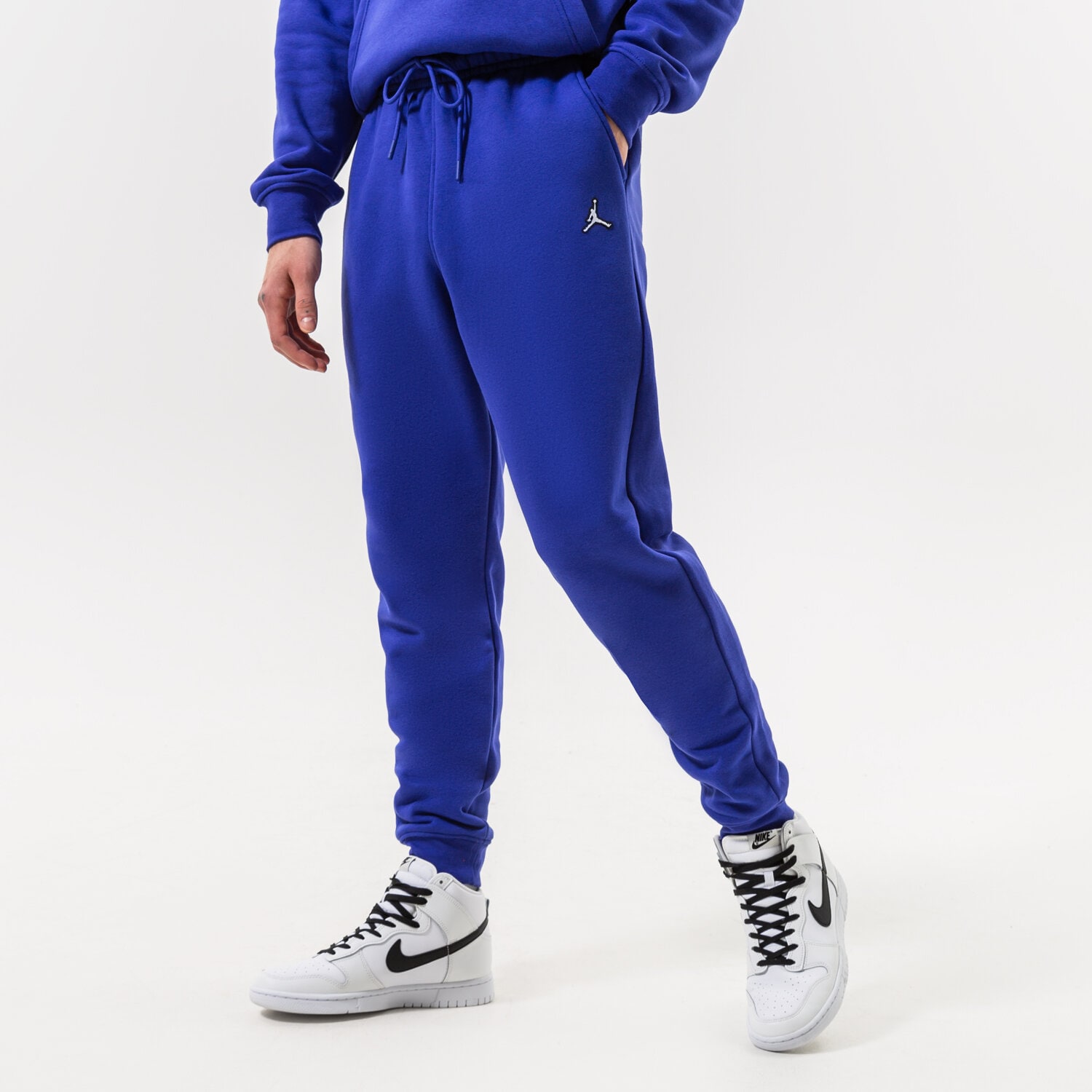Spodnie sportowe męskie JORDAN SPODNIE M J ESSENTIAL FLEECE PANT DQ7340-432 NIEBIESKI