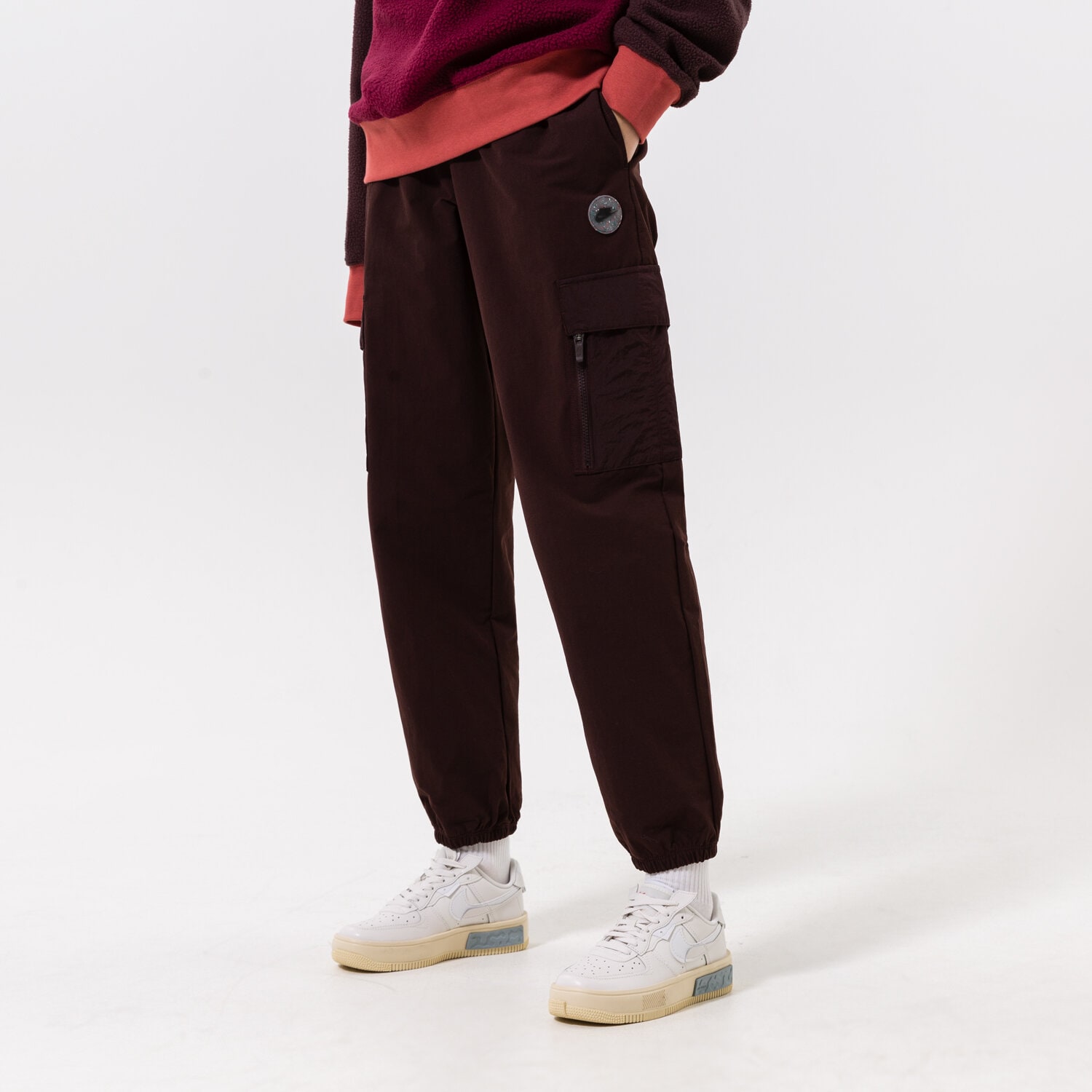 Spodnie sportowe damskie NIKE SPODNIE W NSW WVN CARGO PANT SU