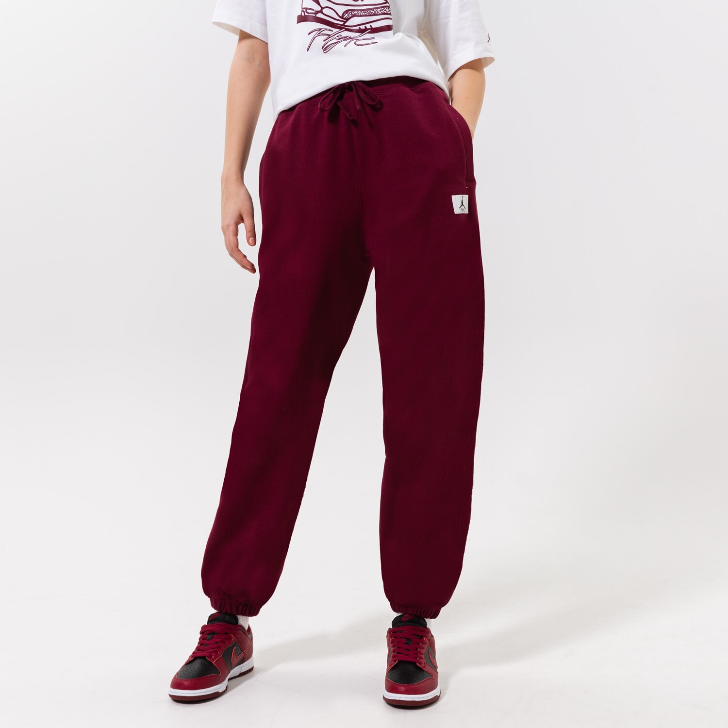 Spodnie sportowe damskie JORDAN SPODNIE W J FLT FLC PANT DQ4607-645 BORDOWY