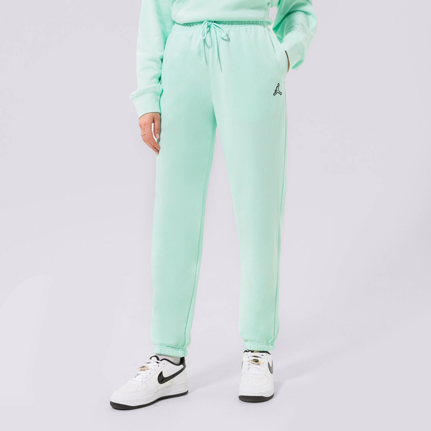 Spodnie sportowe damskie JORDAN SPODNIE ESSENTIAL JOGGERS DN4575-379 miętowy