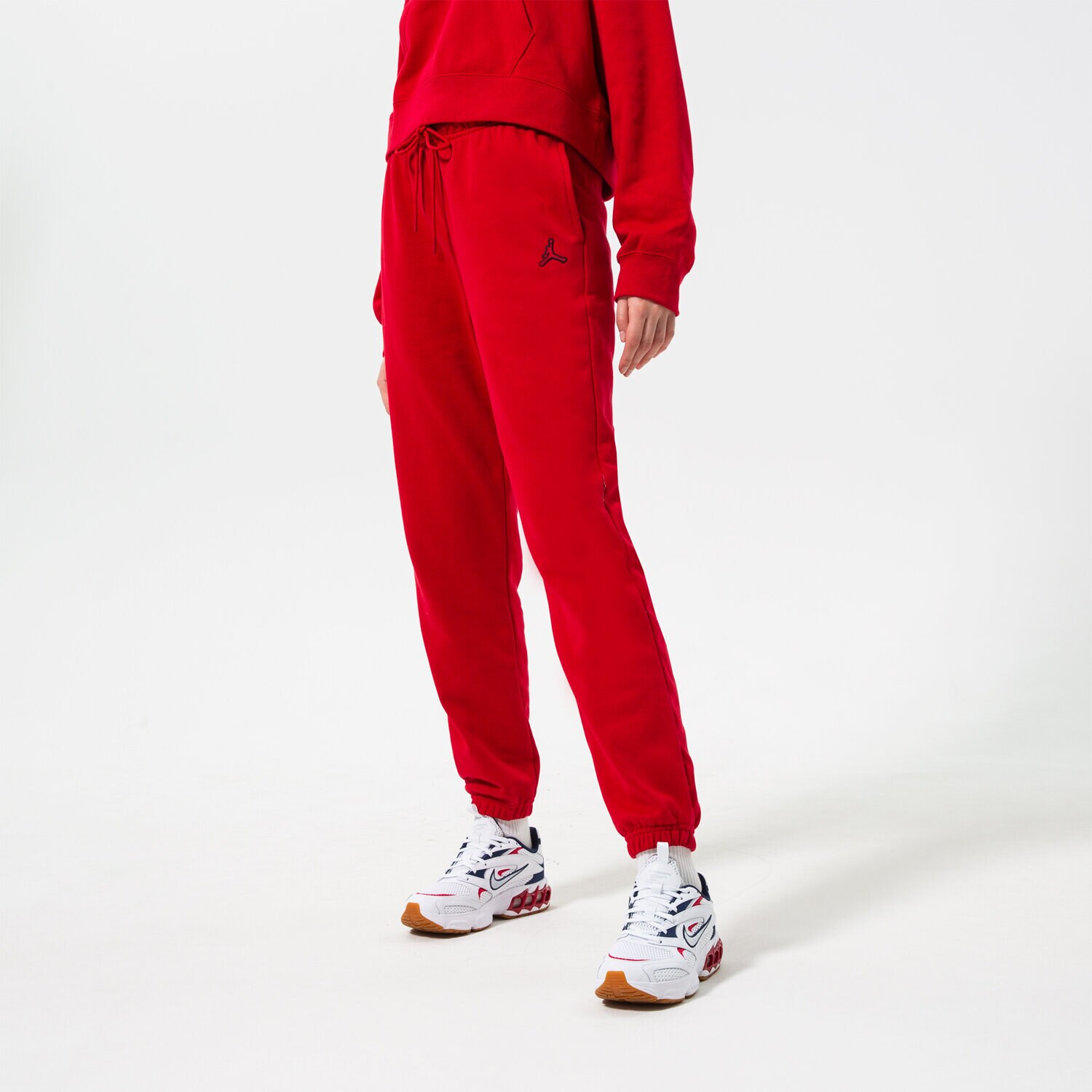 Spodnie sportowe damskie JORDAN SPODNIE W J FLC PANT CORE DN4575-687 CZERWONY
