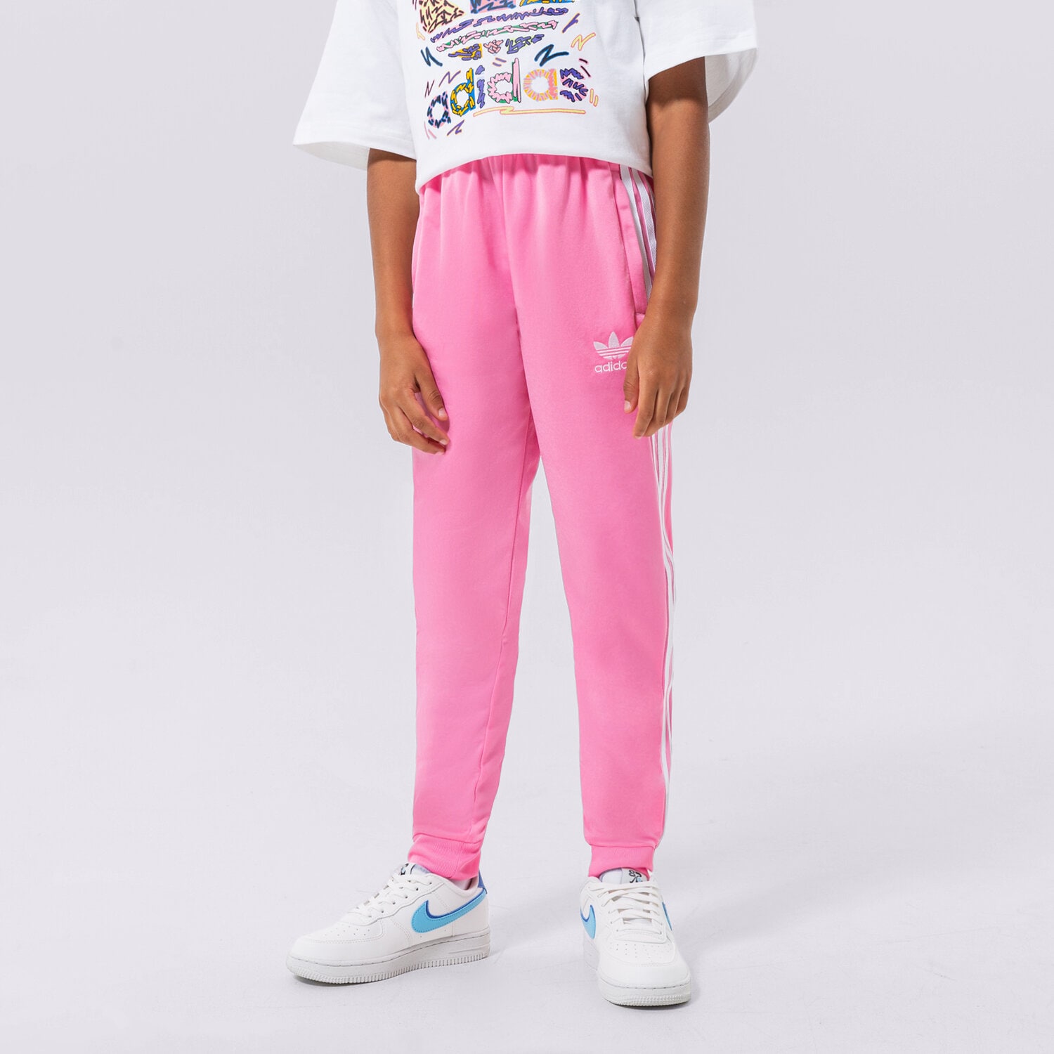 Sportowe spodnie dziecięce ADIDAS SPODNIE SST TRACK PANTS GIRL HK0329 RÓŻOWY