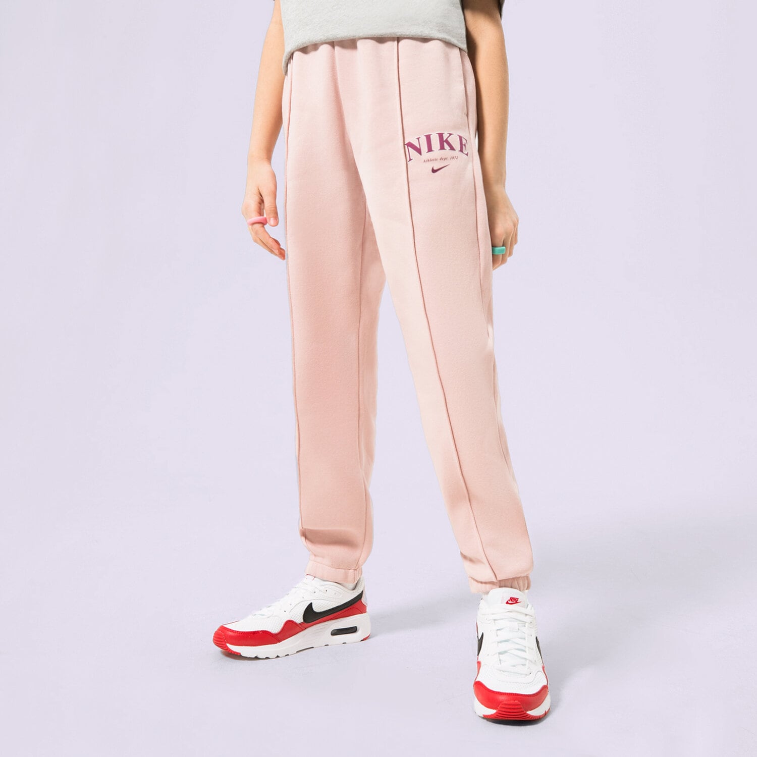 Sportowe spodnie dziecięce NIKE SPODNIE G NSW TREND FLC CF PANT PRNT FD0886-601 RÓŻOWY
