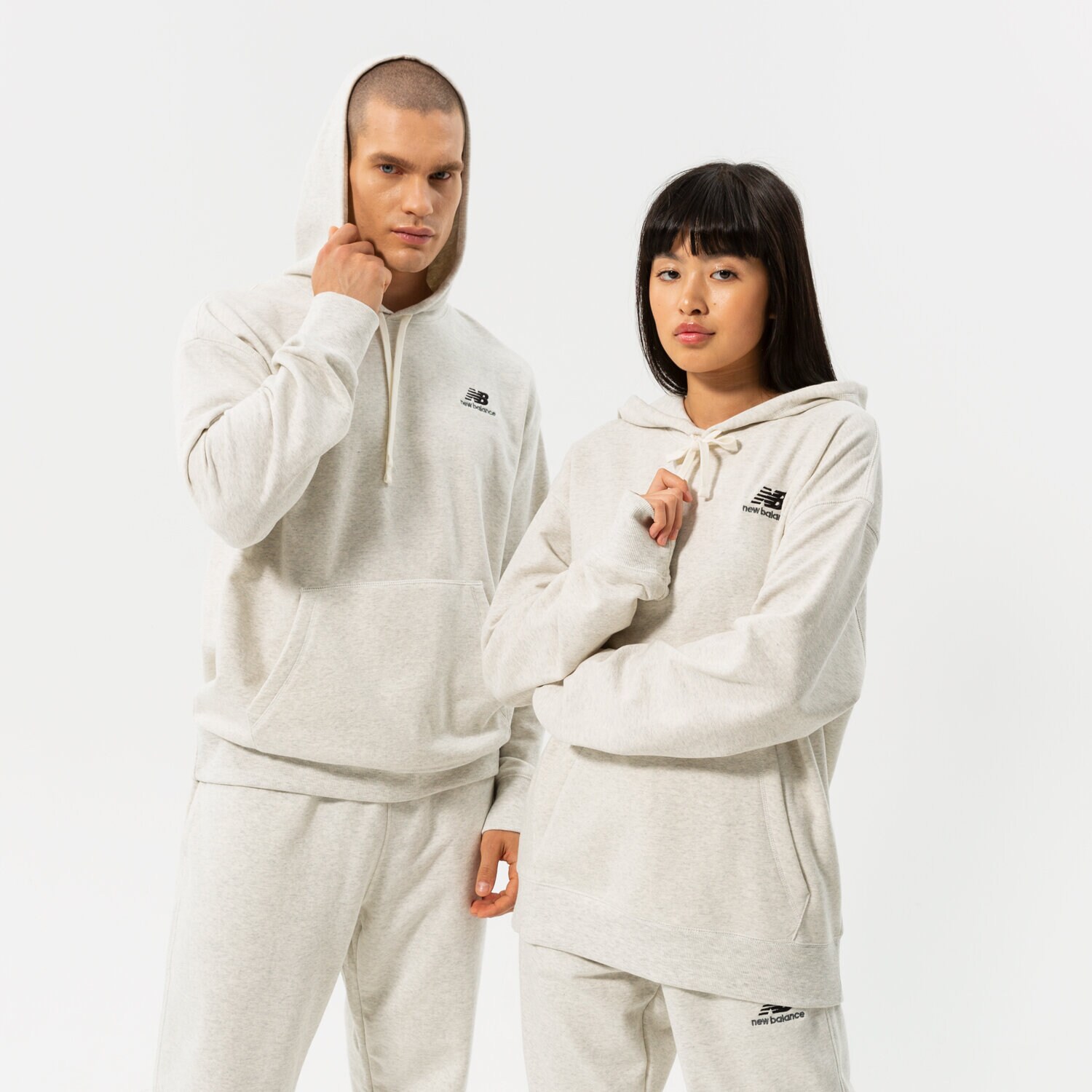 Bluza damska NEW BALANCE BLUZA Z KAPTUREM NB ESSENTIALS UNI-SSENTIALS PO UT21500SAH SZARY