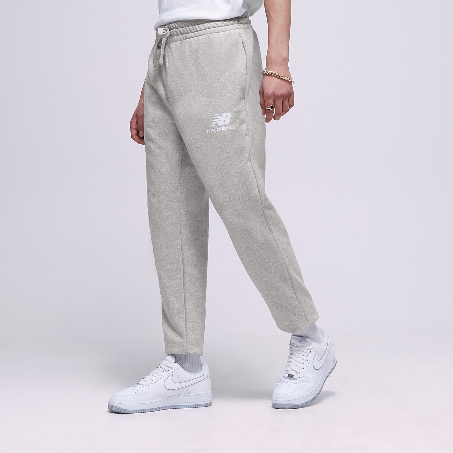 Spodnie sportowe męskie NEW BALANCE SPODNIE NB ESSENTIAL STACKED MP31539AG SZARY