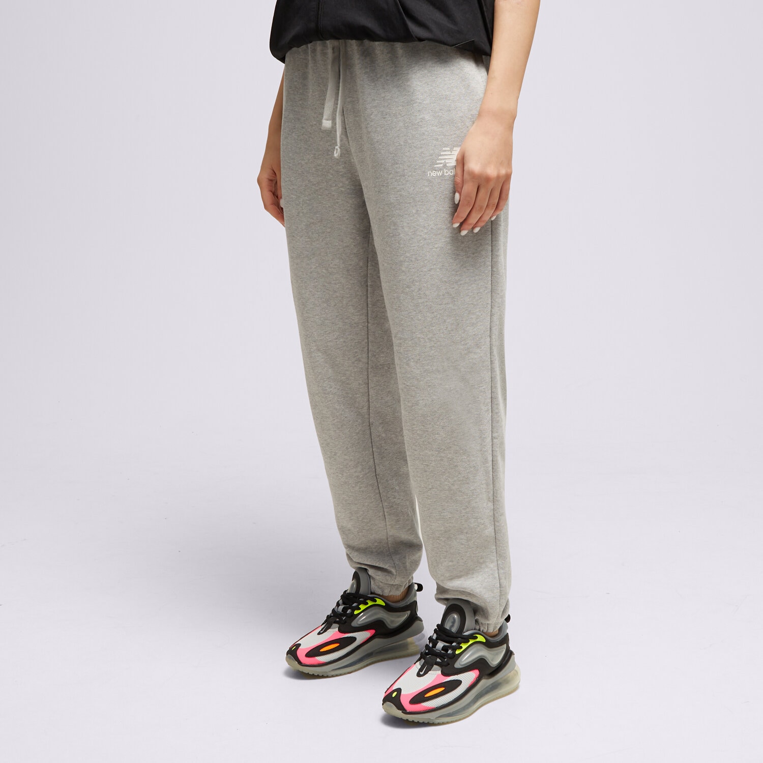 Spodnie sportowe damskie NEW BALANCE SPODNIE NB ESSENTIALS STACKED WP31530AG SZARY